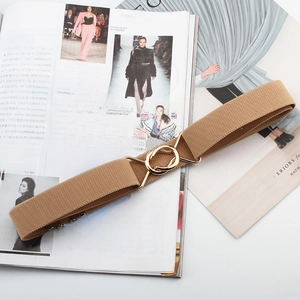 Detail showing khaki elastic woven belt with golden double-ring metal buckle on magazine