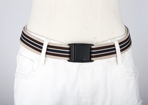 Detail of striped elastic waist belt with plastic buckle on a mannequin waist