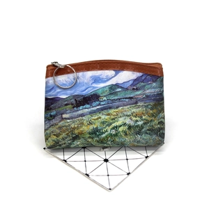 Detail of vintage oil painting canvas coin purse with brown trim and round zipper pull