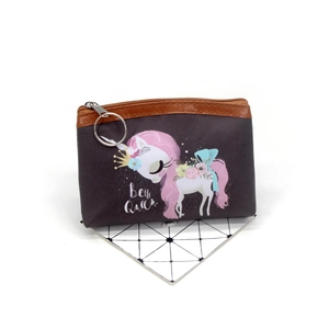 Detail of unicorn coin purse with textured leather and silver ring for key storage
