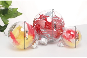 Three transparent PET Christmas balls filled with feathers in 6cm, 8cm, and 10cm sizes
