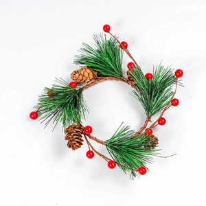 Christmas wreath with green pine needles, red berries and pinecones on a white background