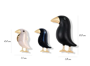 Three raven brooches in black and white marble finish with golden legs and size measurements