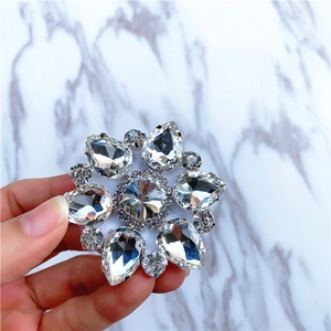 Macro detail of a sparkling crystal flower ring holder with silver alloy base