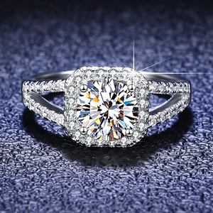 Macro shot of 1 carat moissanite ring with halo square setting and pavé split band