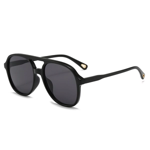 Classic double bridge oval aviator sunglasses with black frame and grey lenses in 45-degree view
