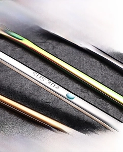 Macro view of long handle coffee spoons with SUS 304 engraving in various metallic finishes