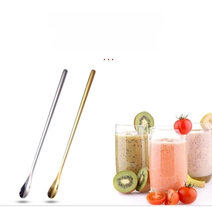 Detailed view of silver and gold long-handle stainless steel spoons with sleek finish