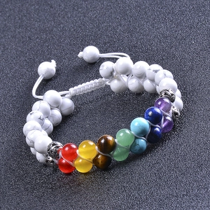 Macro detail of double-layer white turquoise beads and colorful chakra natural stones