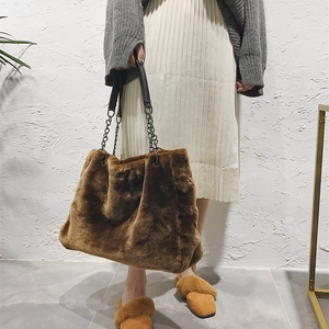 Brown faux fur tote bag with chain strap and large capacity for winter fashion style