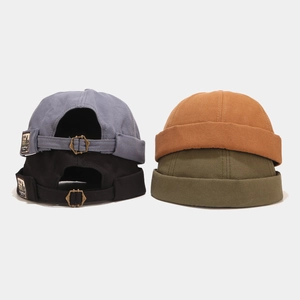 Vintage cotton docker hats in blue, black, yellow, and green with adjustable buckles