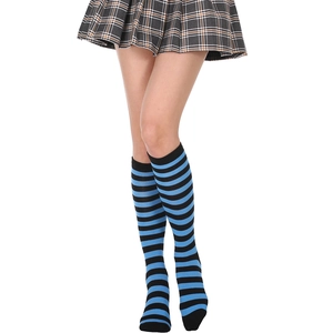 Detail of blue and black striped knee-high socks paired with a plaid pleated skirt
