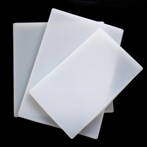Three rectangular translucent white silicone resin molds stacked on a black background