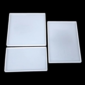 Three translucent silicone resin molds in rectangular and square shapes for DIY craft projects