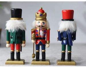 Three-piece set of wooden Nutcracker ornaments with red, blue and green soldier designs