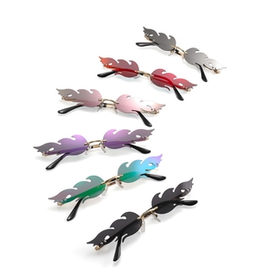 Frameless flame-shaped sunglasses in six colors with metal temples for festive parties