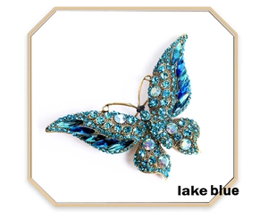 Detailed view of the lake blue crystal butterfly brooch with intricate gold-tone setting