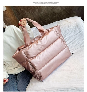 Pink quilted fitness bag with waterproof fabric and large capacity shown in a lifestyle setting