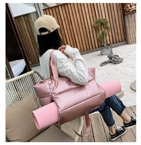 Pink waterproof fitness bag featuring a specialized yoga mat holder strap and large capacity
