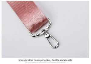 Close-up of pink woven shoulder strap with durable silver metal lobster clasp