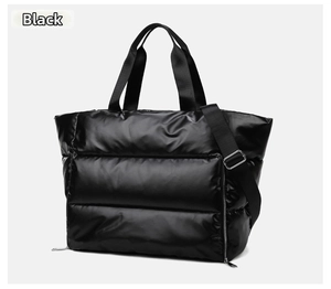 Detail view of large capacity black waterproof nylon sports bag with quilted texture