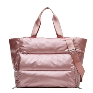 Pink quilted puffer gym bag with waterproof fabric and adjustable strap for women