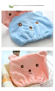 Detail of plush microfiber hair drying caps featuring cute cartoon bear faces and soft ears