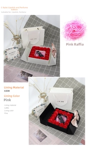 Detail of soap rose gift box with ribbon bow, greeting card and matching paper bag