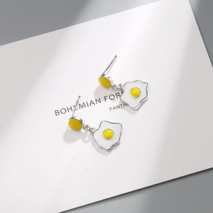Cute fried egg stud earrings with white enamel and yellow yolk in silver finish