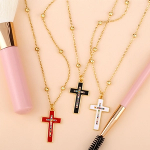 Classic vintage cross necklaces with colorful rhinestones in red, black, and white colors