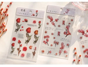 Close-up of PET floral stickers with rose and cherry blossom designs for DIY journaling