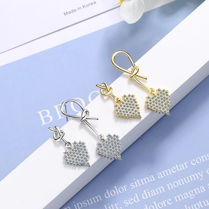 Elegant gold and silver heart drop earrings with micro-set zircon and twisted metal design