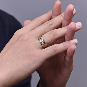 Minimalist titanium steel ring for men with two-tone gold twist and polished silver finish