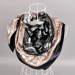 Classic paisley print square silk scarf in black and brown on a minimalist display