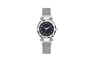 Detail of silver mesh band watch with blue starry sky dial and faceted glass bezel