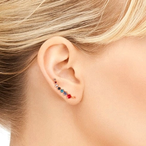 Rainbow zirconia ear climber earrings in rose gold plating worn on model's ear
