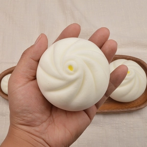 Squeeze toy simulated steamed bun made of soft PU foam held in hand for stress relief