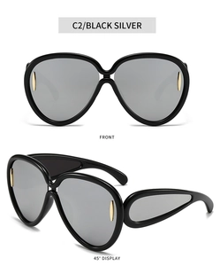 Vues de face et à 45 degrés de lunettes de soleil oversize tendance avec verres miroirs argentés