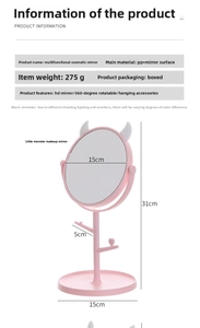 Pink monster makeup mirror with 360-degree rotation and jewelry hooks for vanity