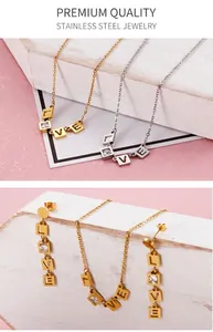 Macro detail of LOVE letter square pendants with cubic zirconia on gold and silver chains