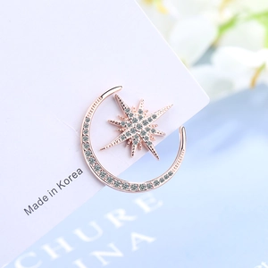 Elegant rose gold moon and star earrings with zircon inlay on a white display card