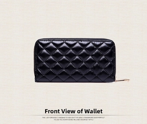 Detailed view of a black quilted leather long wallet with gold-tone zipper closure