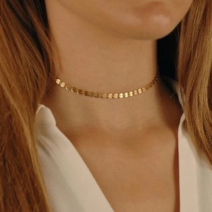 Detail of 18k gold plated choker featuring small circular disks on a chain