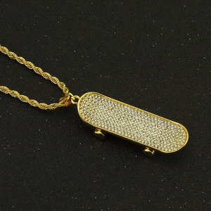 Gold skateboard pendant necklace with sparkling rhinestones on a twisted rope chain