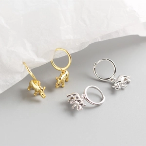 Detailed close-up of S925 sterling silver elephant and rhino hoop earrings in gold and silver