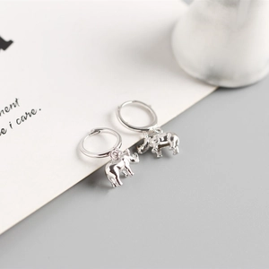 Detail view of 925 sterling silver hoop earrings with 3D rhinoceros pendant charms