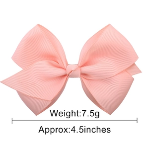 Pink 4.5 inch grosgrain ribbon bow hair clip for girls with a classic knotted center design