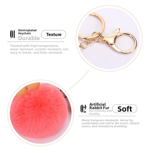 Close-up of pink faux rabbit fur pom pom keychain with durable gold lobster clasp details