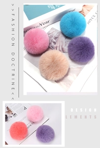 Detailed view of fluffy 8cm faux rabbit fur pompom charms in vibrant assorted colors
