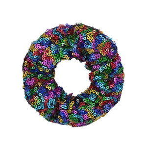 Detail of colorful sequins on elastic scrunchie showing rainbow reflections and texture